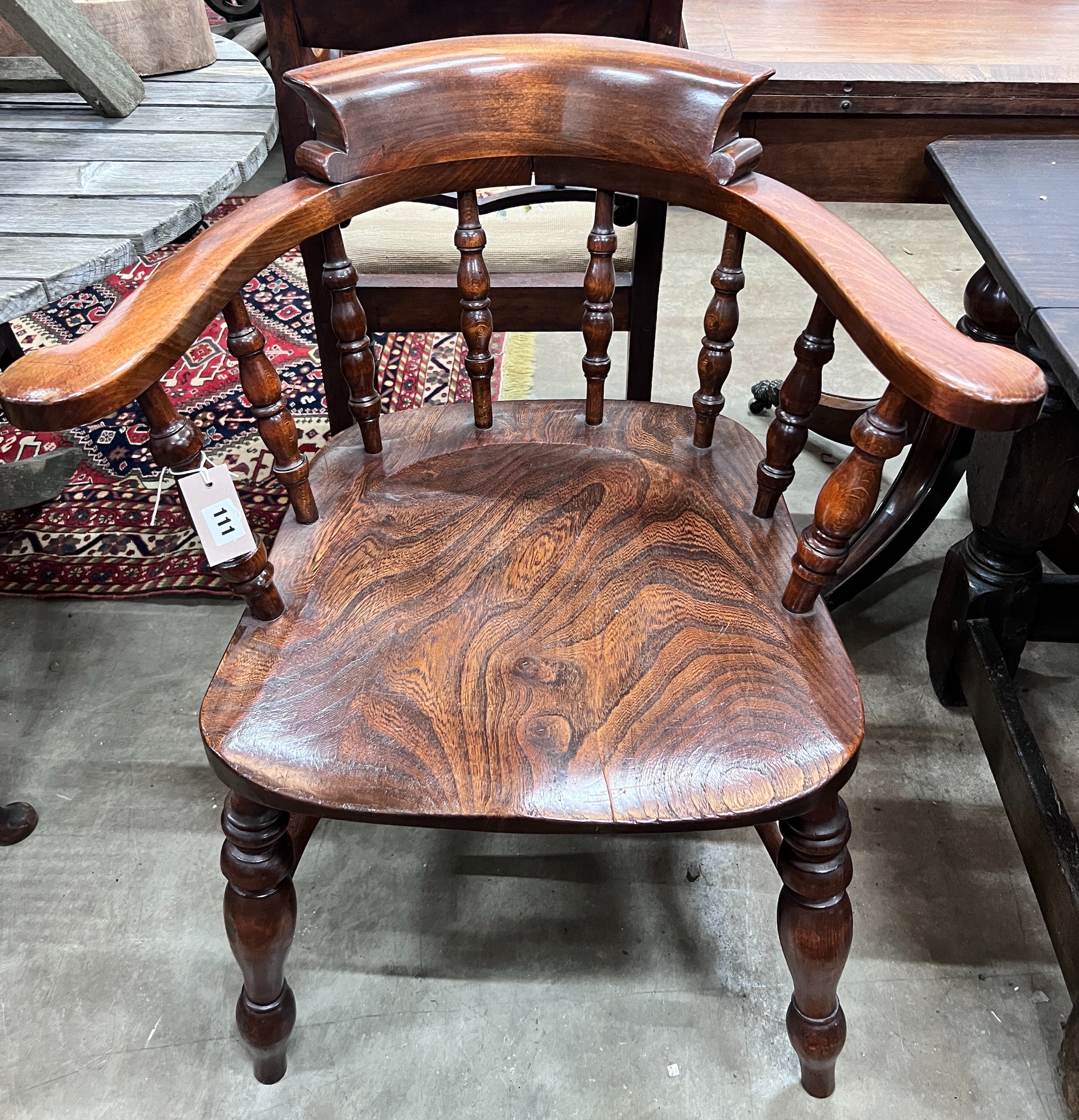 A Victorian style elm and beech smoker's bow chair, width 69cm, depth 50cm, height 82cm *Please note the sale commences at 9am.
